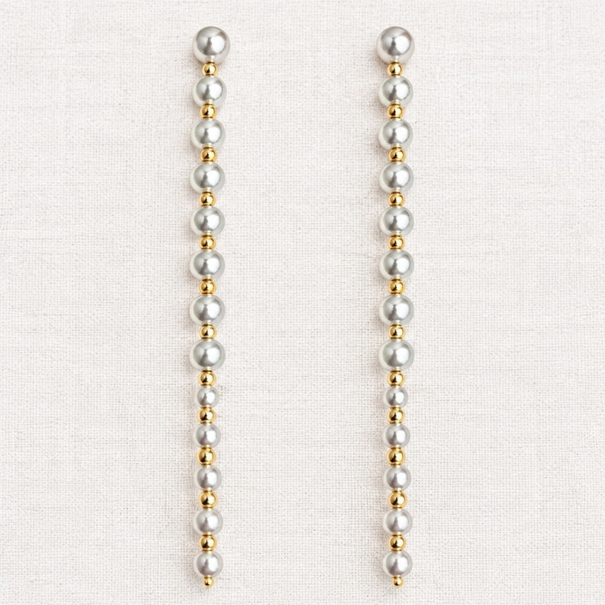 ELLEMADERA GEOMETRIC BOW FAUX PEARL TASSEL EARRING